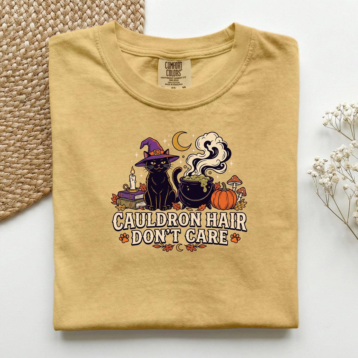 Cauldron Hair Don't Care graphic tee in Mustard, folded flat lay