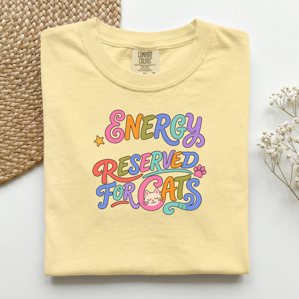 Energy Reserved for Cats graphic tee in Butter, folded flat lay