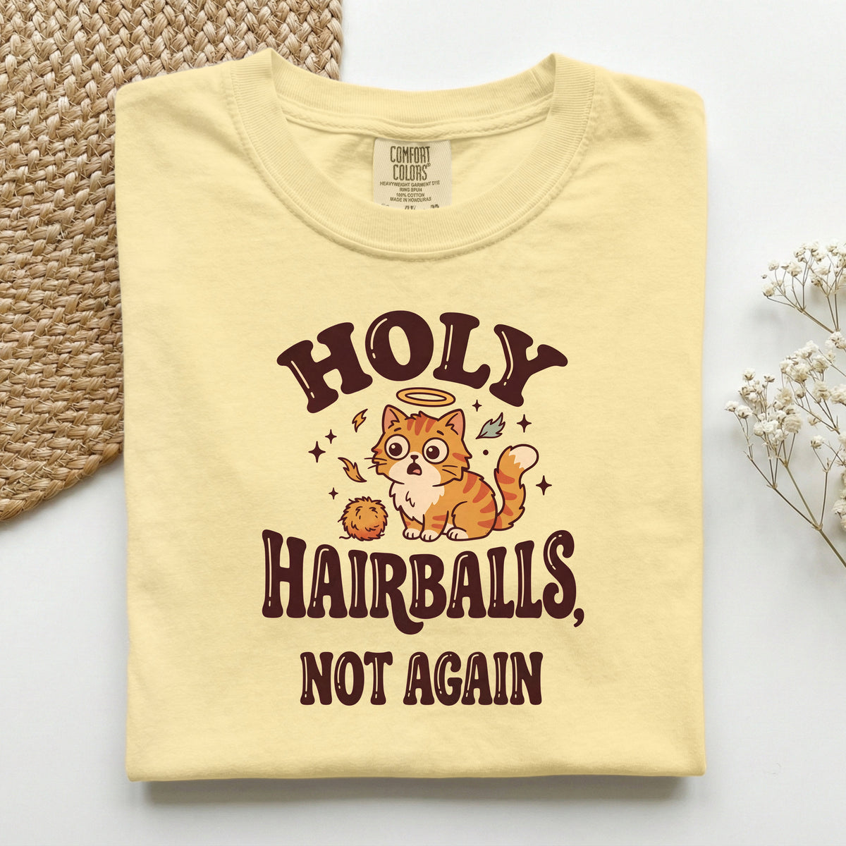 Holy Hairballs, Not Again graphic tee in Butter, folded flat lay