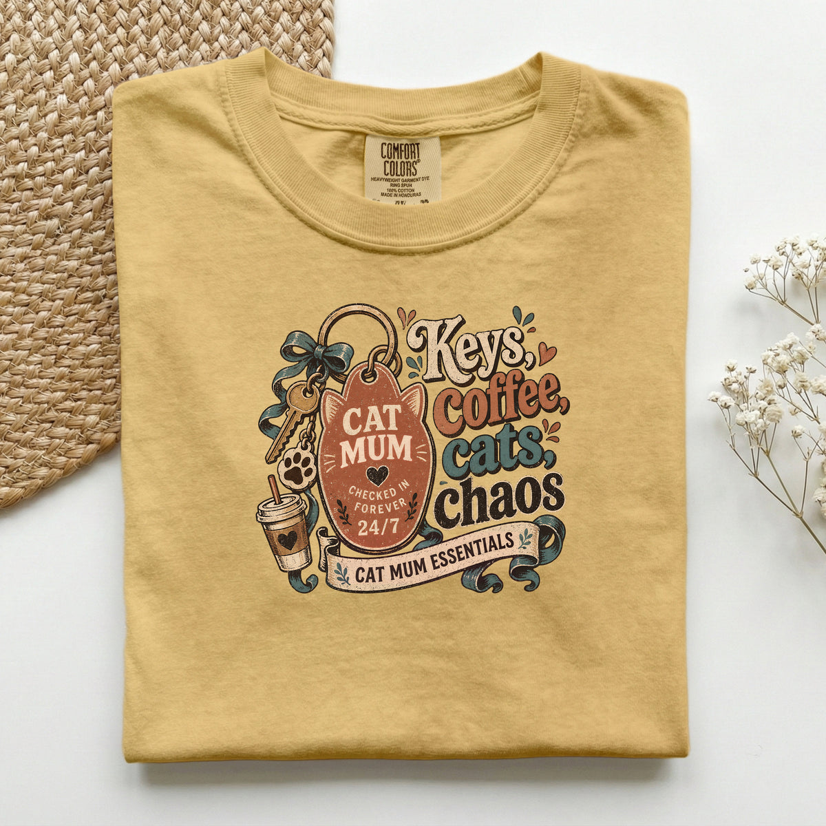 Keys, Coffee, Cats, Chaos graphic tee in Mustard, folded flat lay