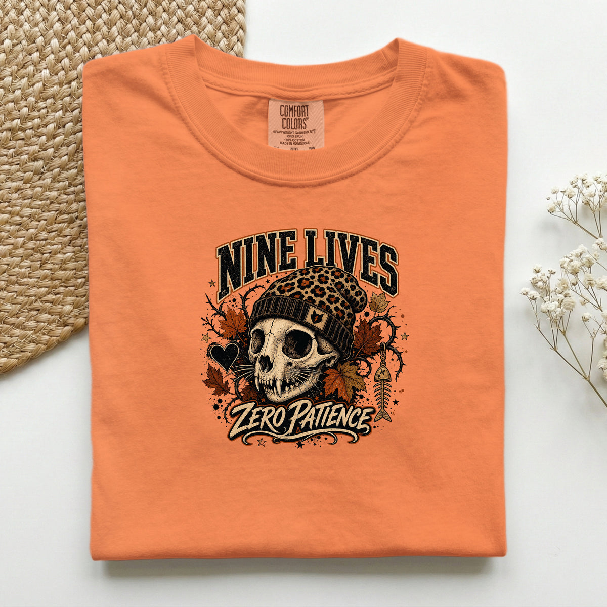 Nine Lives Zero Patience graphic tee in Burnt Orange, folded flat lay
