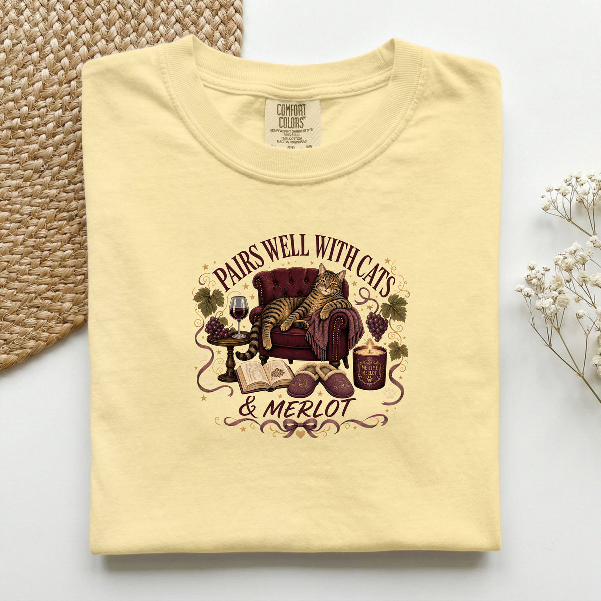 Pairs Well with Cats & Merlot graphic tee in Butter, folded flat lay