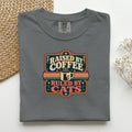 Raised By Coffee Ruled By Cats graphic tee in Pepper, folded flat lay