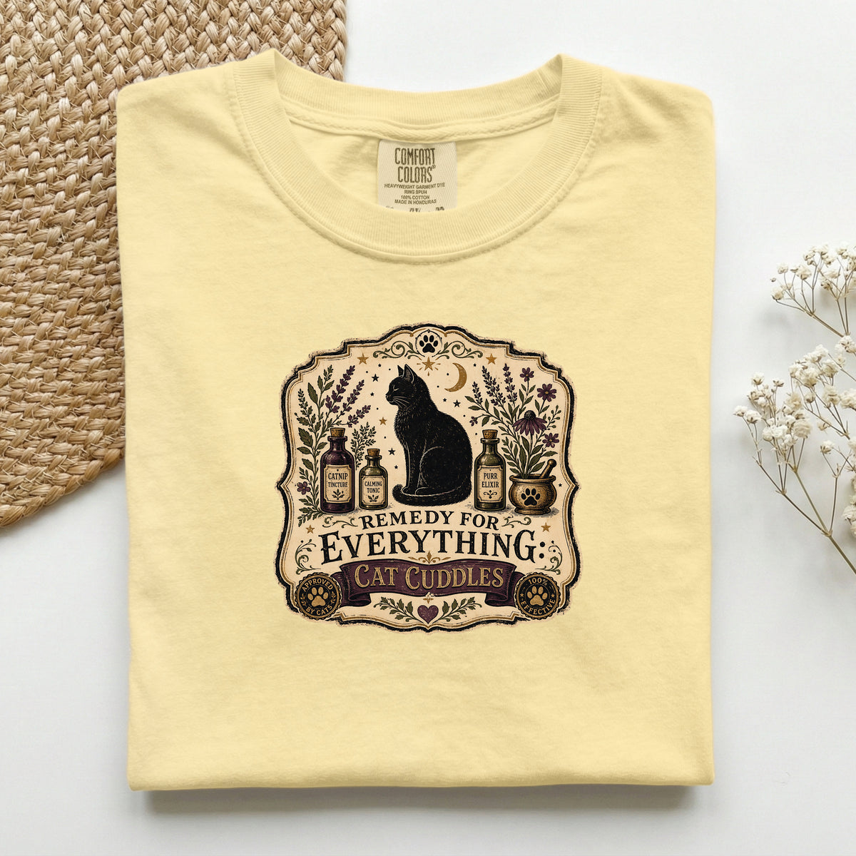 Remedy For Everything graphic tee in Butter, folded flat lay