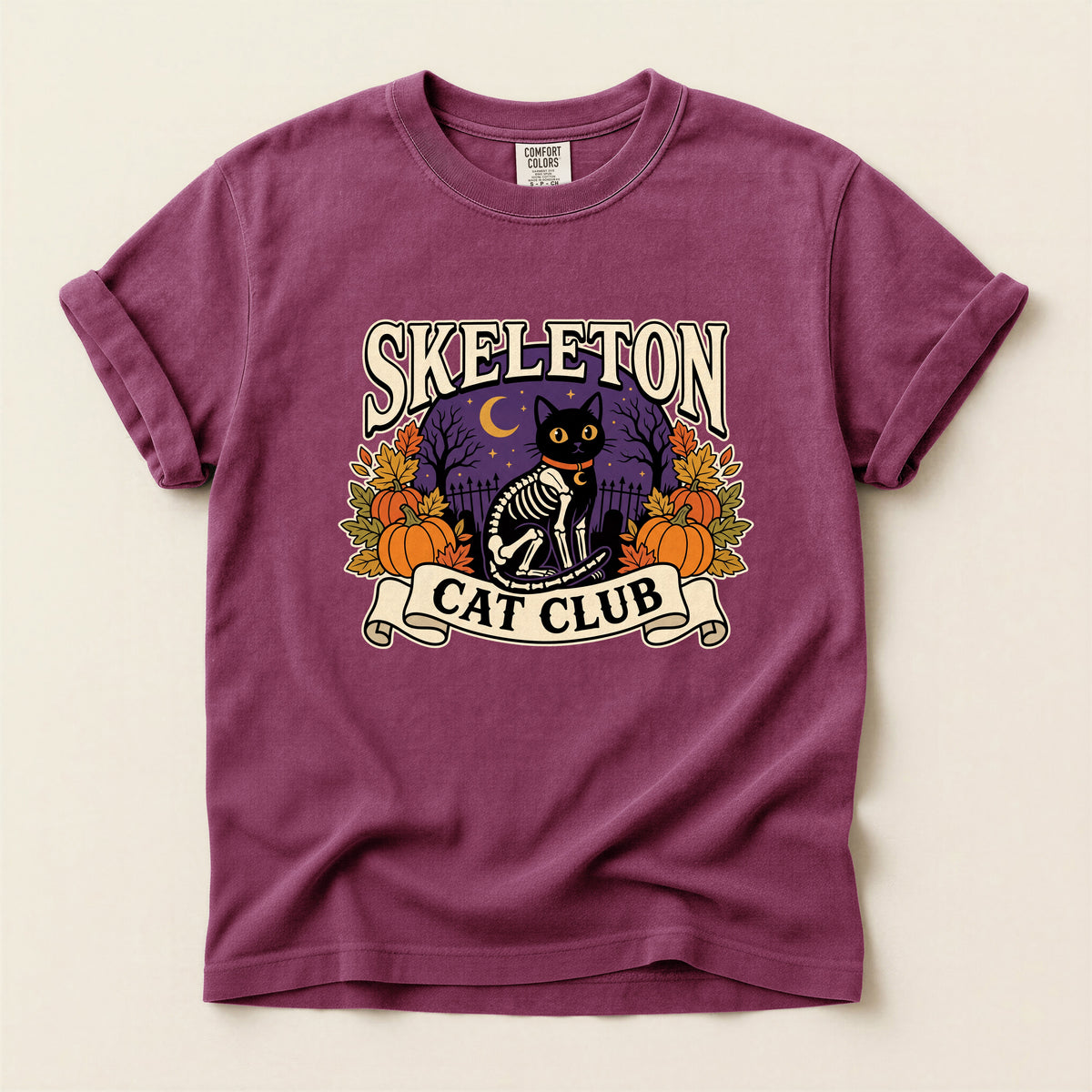 Skeleton Cat Club graphic tee in Berry, flat lay