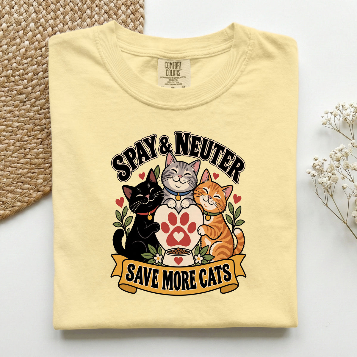 Spay & Neuter Save More Cats graphic tee in Butter, folded flat lay