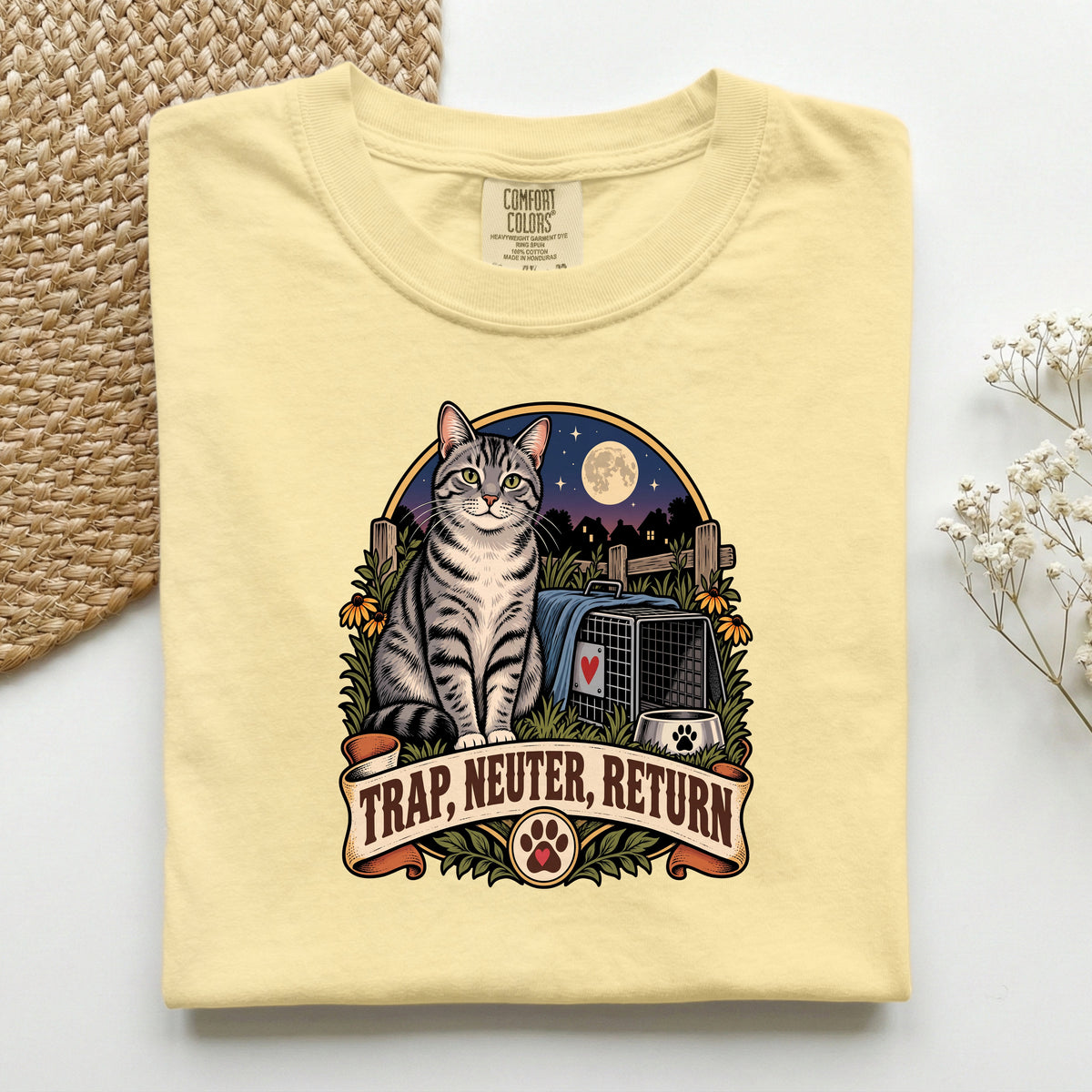 Trap, Neuter, Return graphic tee in Butter, folded flat lay