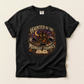Haunted By The Midnight Zoomies graphic tee in Black, folded flat lay